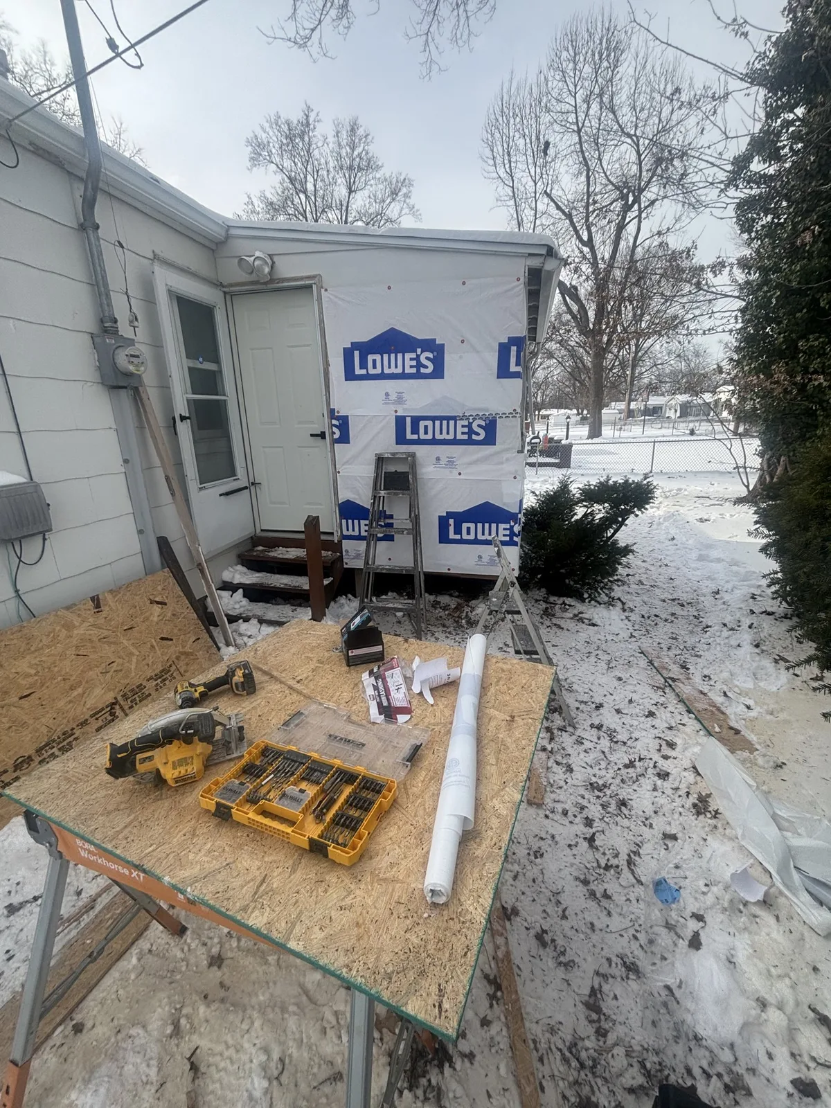 Tools and building materials on site during the Attica exterior rebuild